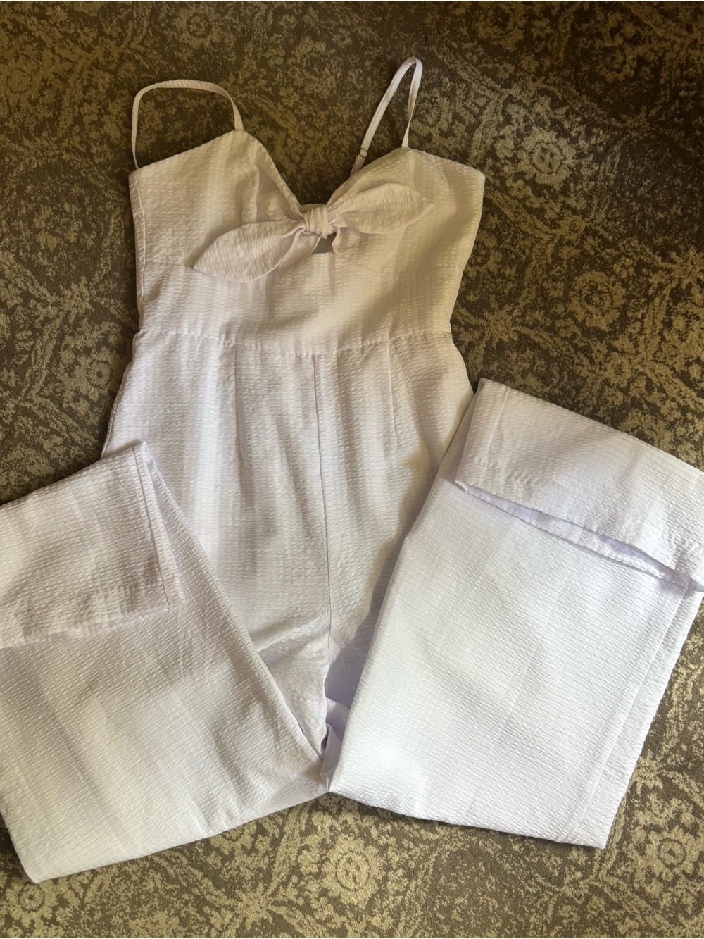 White jumpsuit with subtle texture weave and adjustable straps -size 6